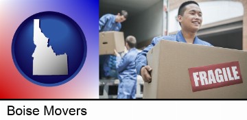 movers unloading a moving van and carrying a fragile box in Boise, ID