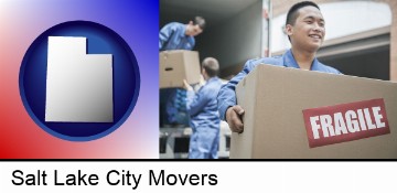 movers unloading a moving van and carrying a fragile box in Salt Lake City, UT