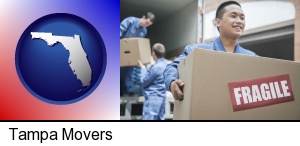 movers unloading a moving van and carrying a fragile box in Tampa, FL
