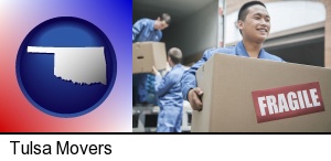 Tulsa, Oklahoma - movers unloading a moving van and carrying a fragile box