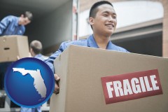 florida map icon and movers unloading a moving van and carrying a fragile box