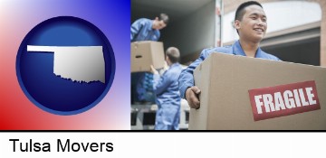 movers unloading a moving van and carrying a fragile box in Tulsa, OK
