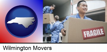 movers unloading a moving van and carrying a fragile box in Wilmington, NC