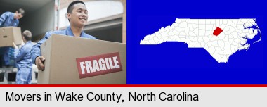movers unloading a moving van and carrying a fragile box; Wake County highlighted in red on a map